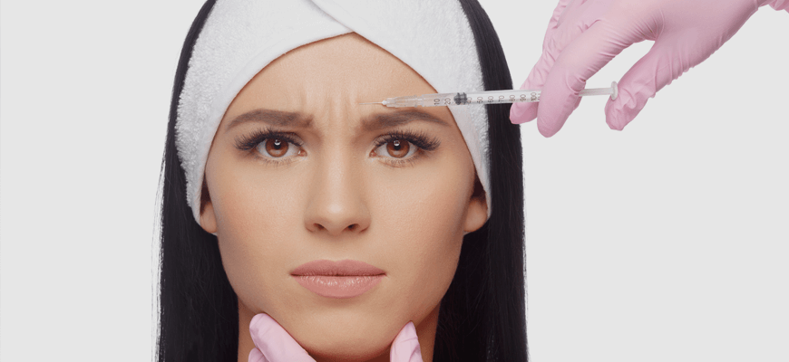 Palisades Vein Center- a woman receiving botox in her forehead